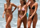 Naughty wild girls with awesome bikini suits walks on the nudist beach