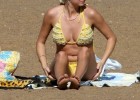 Hot blonde babe in sexy yellow bikinis