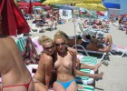 Charming attractive babes at the beach topless with round incredible diddies