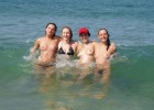 Cute teenage girls caught naked in the blue water showing their boobies and thongs