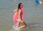 Topless teen with her balloon in warm ocean water caught by a curious voyeur