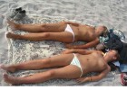 Topless lusty housewives chilling and stretched out for sunbath