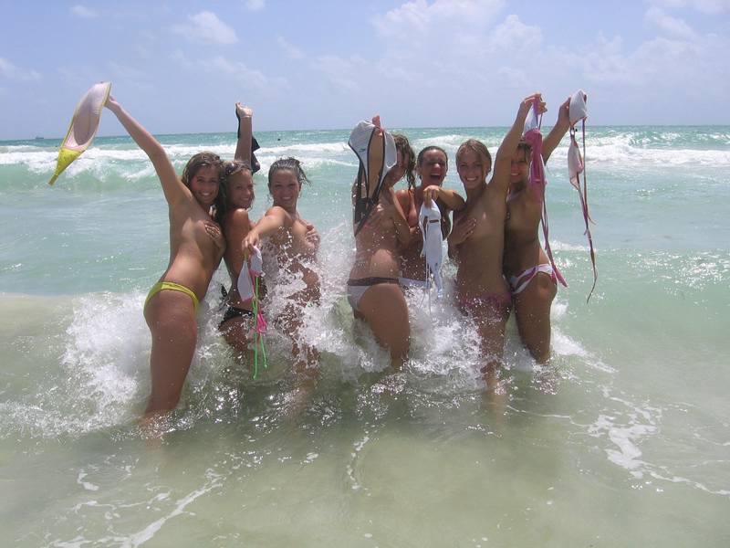 College girls getting wet and wild in the shoreline