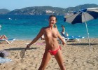 Luscious naked lass beach dancing with a whacker