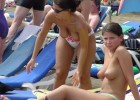 Pretty naked ladies making the best out of a crowded nudist beach
