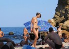 Sizzling hot topless model walking aimlessly after finding the beach crowded and freakish