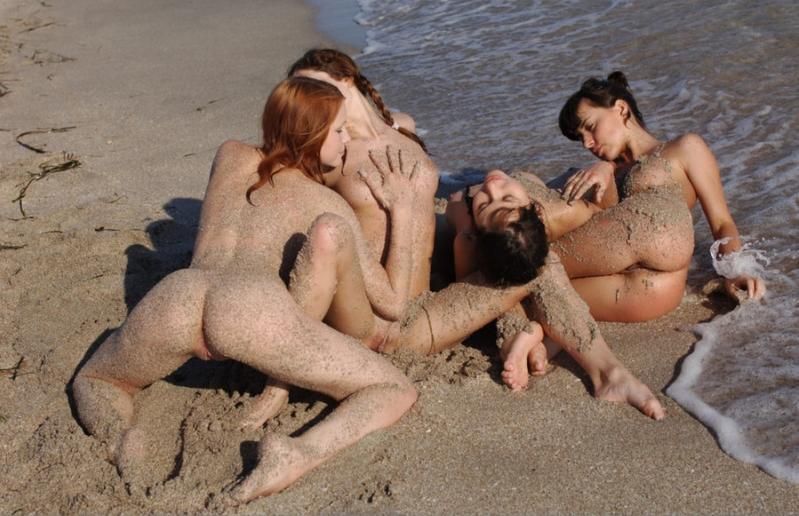 Four hoes intertwined and covered in the sand