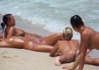 Topless girls sunbathing all their curves